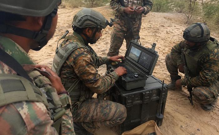 Field-deployed surveillance equipment with Indian Army personnel